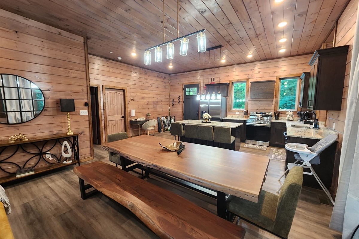 Dining area and fully equipped kitchen — designed for group meals and entertaining.