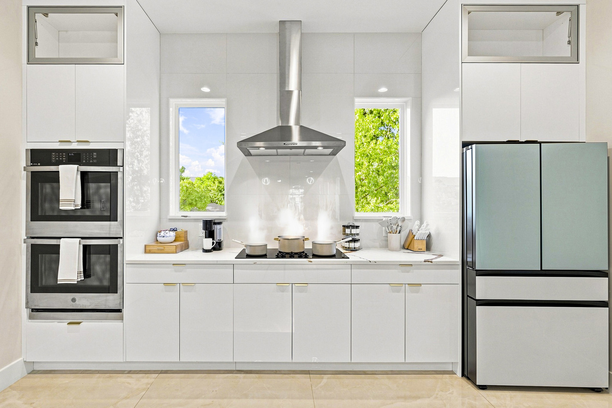 Sunlit space with sleek appliances, perfect for culinary adventures!