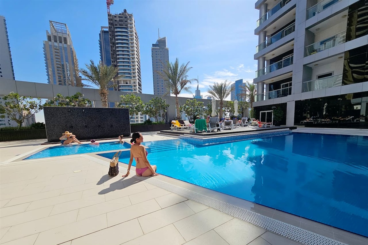 The pool have sun loungers, jacuzzi, small pool for kids, outdoor showers and a changing room. 