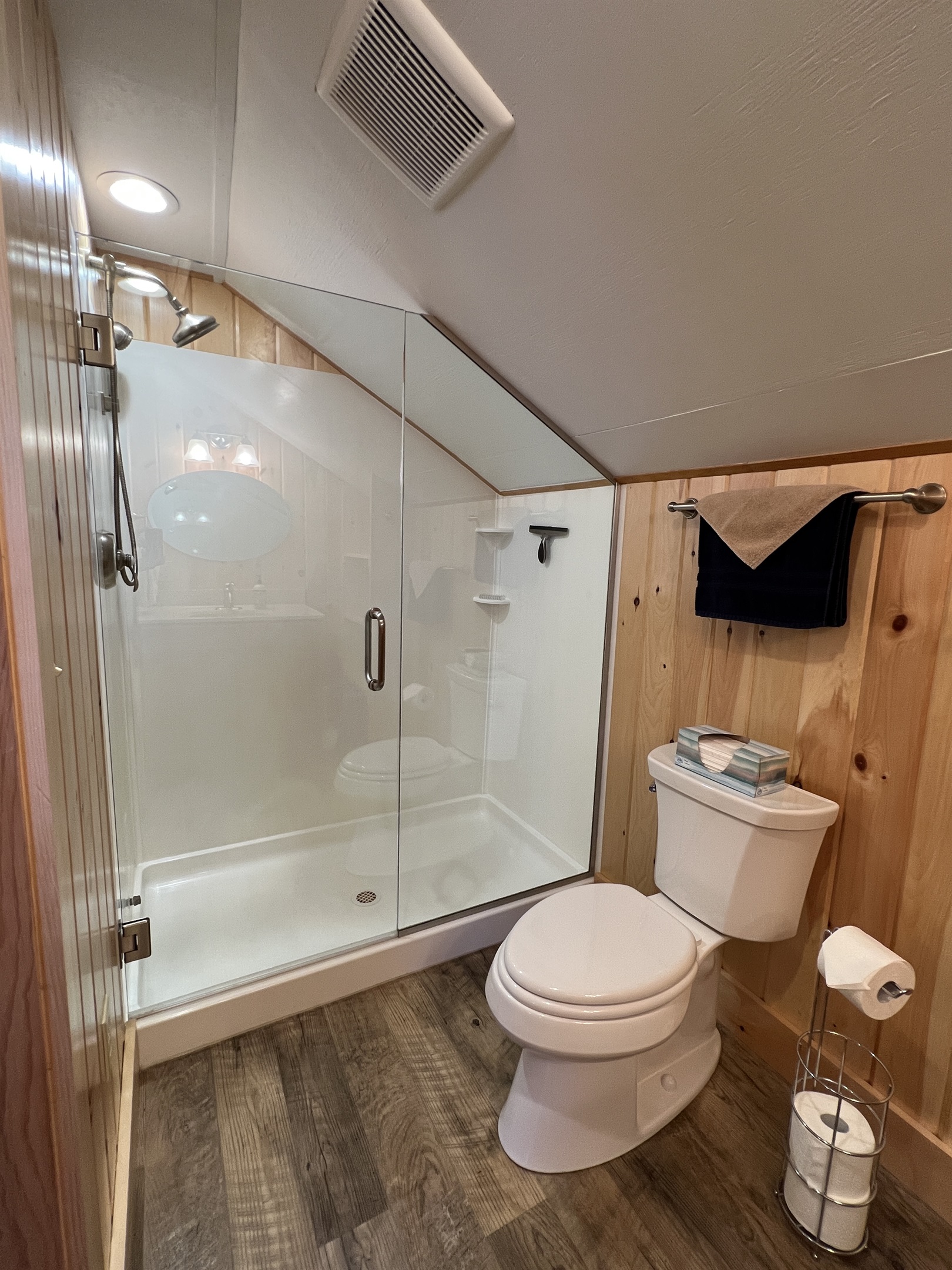 Primary queen bedroom ensuite bathroom with frameless glass shower.
