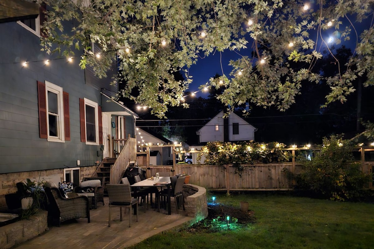 Private and spacious fenced yard is a lovely place to come together during the day and at night.