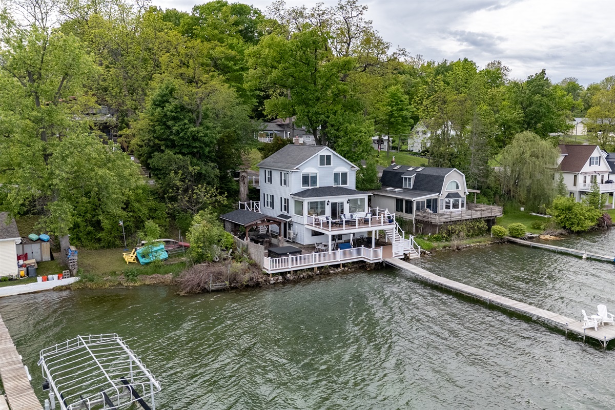 Stunning lakefront home with multi-level decks and a private dock—perfect for sunrise coffees and sunset cocktails 🌅🏡🚤