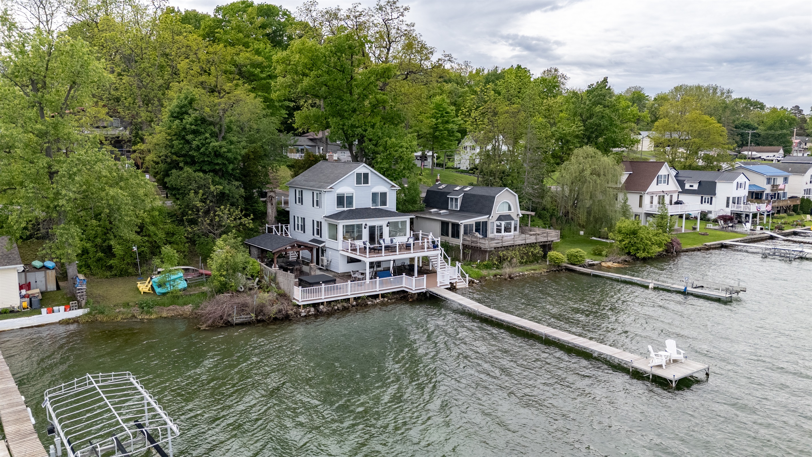 Stunning lakefront home with multi-level decks and a private dock—perfect for sunrise coffees and sunset cocktails 🌅🏡🚤