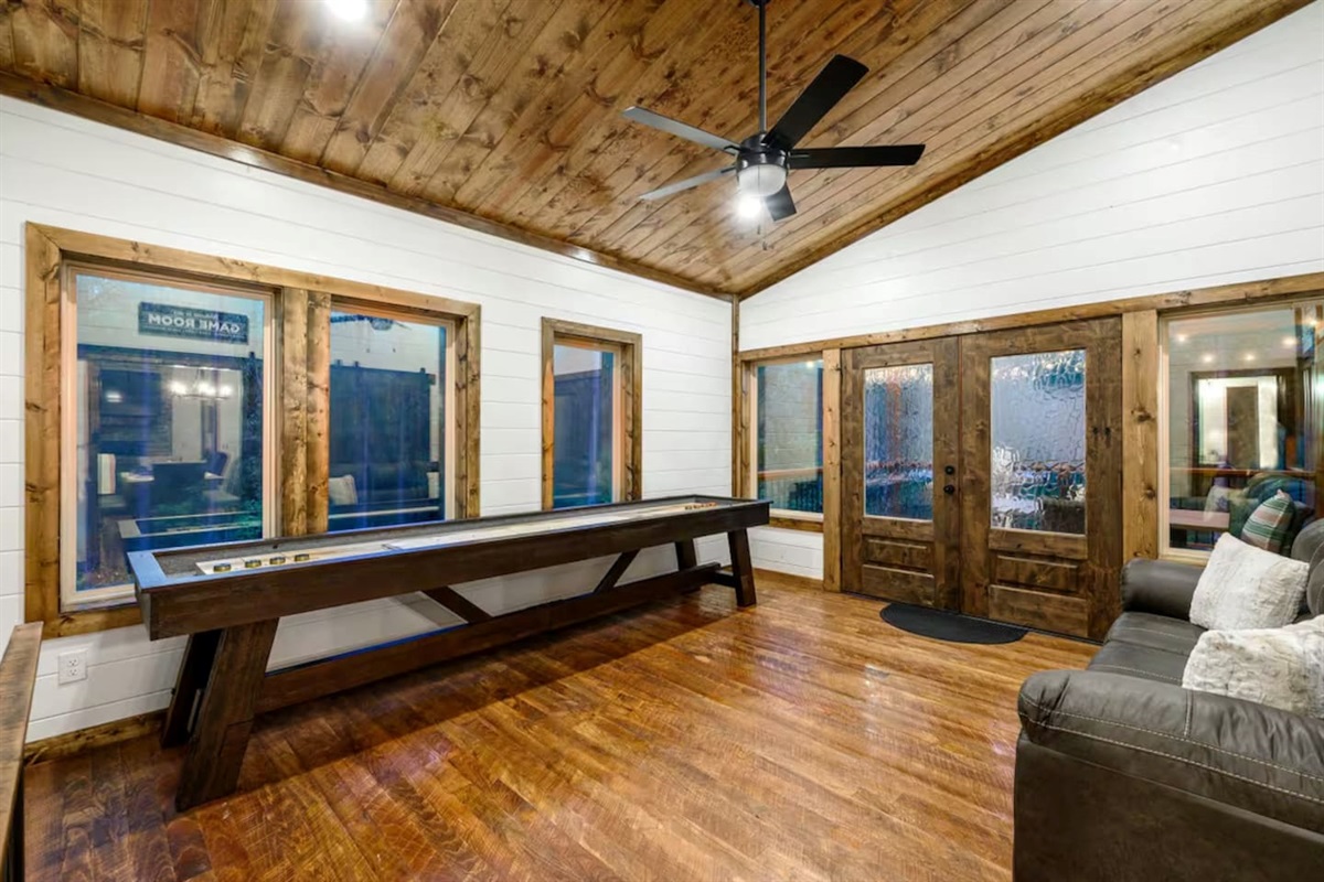 Gather ‘round for shuffleboard battles and chill moments in this inviting retreat.