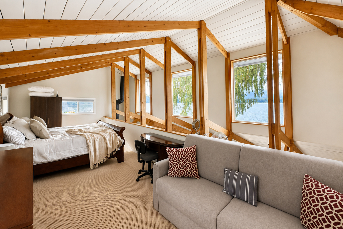 Bedroom 1 King. King bedroom with beautiful views overlooking the lake, creating a peaceful setting to wake up and unwind.