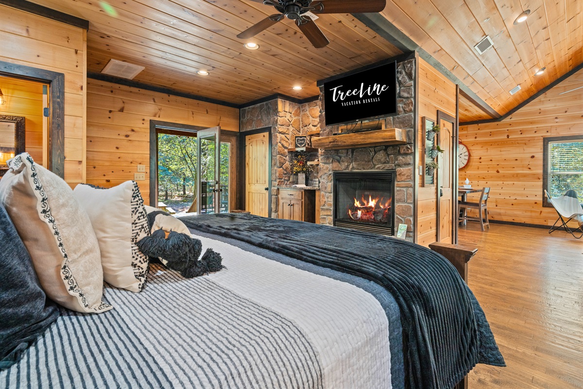 Spacious bedroom featuring luxury bedding and soft lighting.