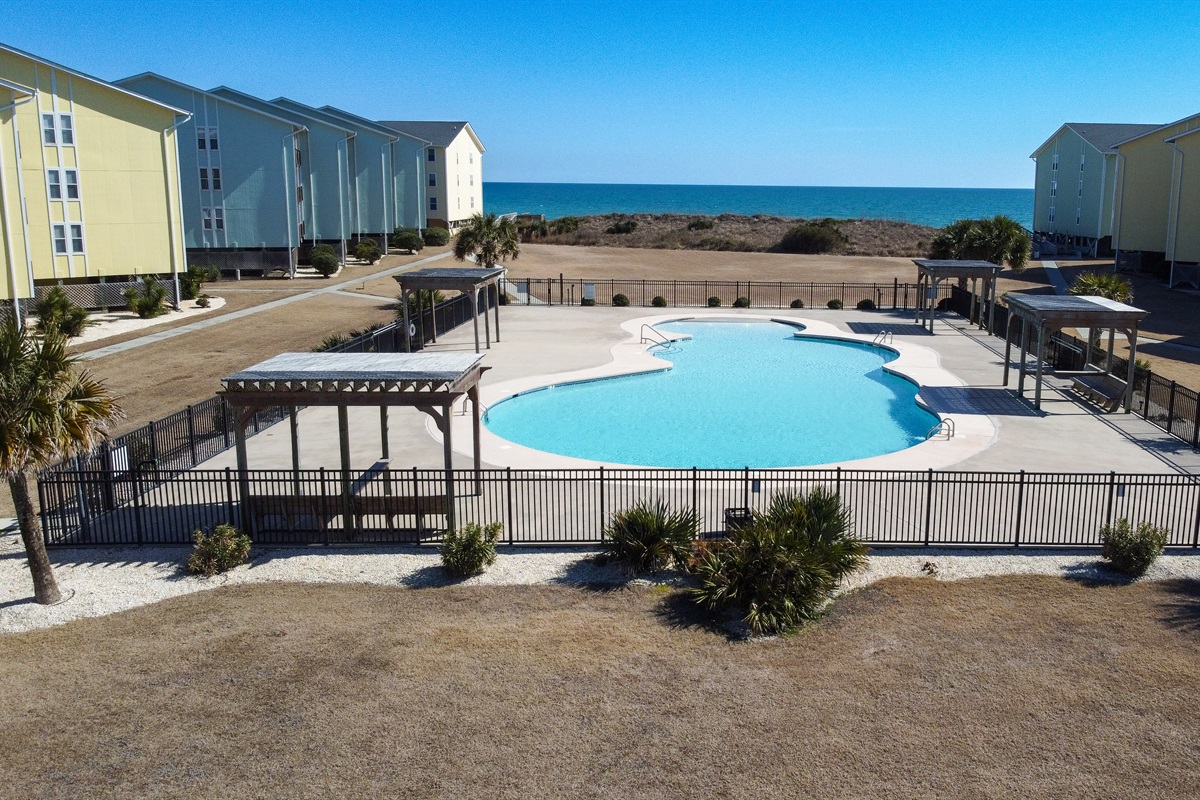 Bird's-eye view of the pool and courtyard at Surf Condos