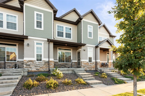 A warm and modern welcome awaits you at this stylish townhome