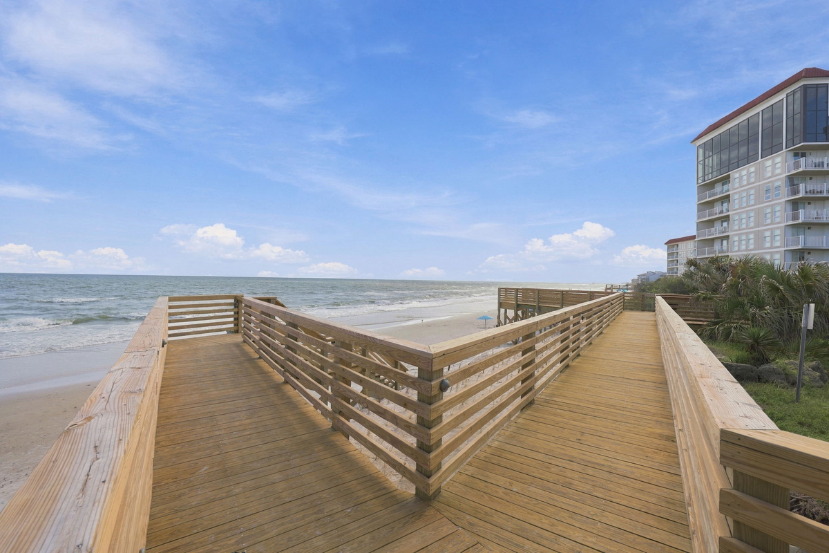 Private boardwalk access taking you straight from the resort to the soft sand and ocean waves.