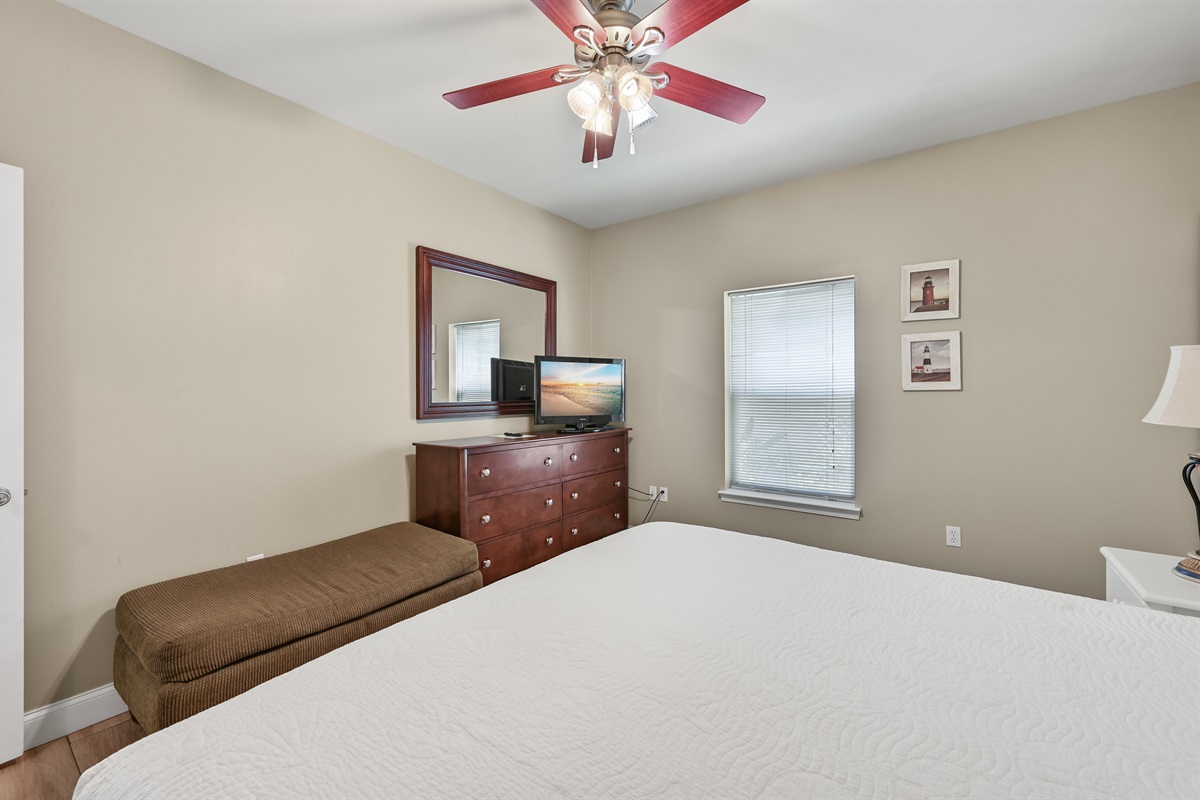 BEDROOM #1: King Bed with nightstands, dresser, and TV. (located on the 1st floor)