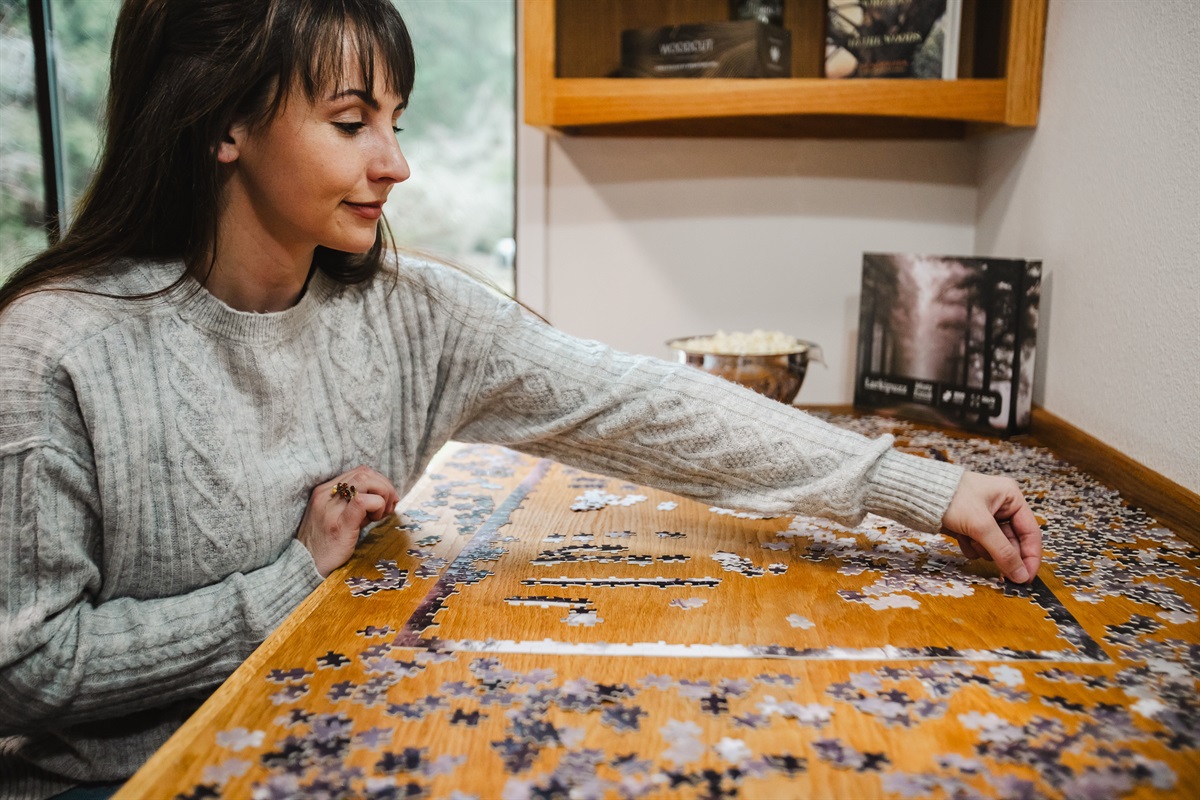 The dedicated and well-lit puzzle table in the library is a relaxing way to spend an afternoon.