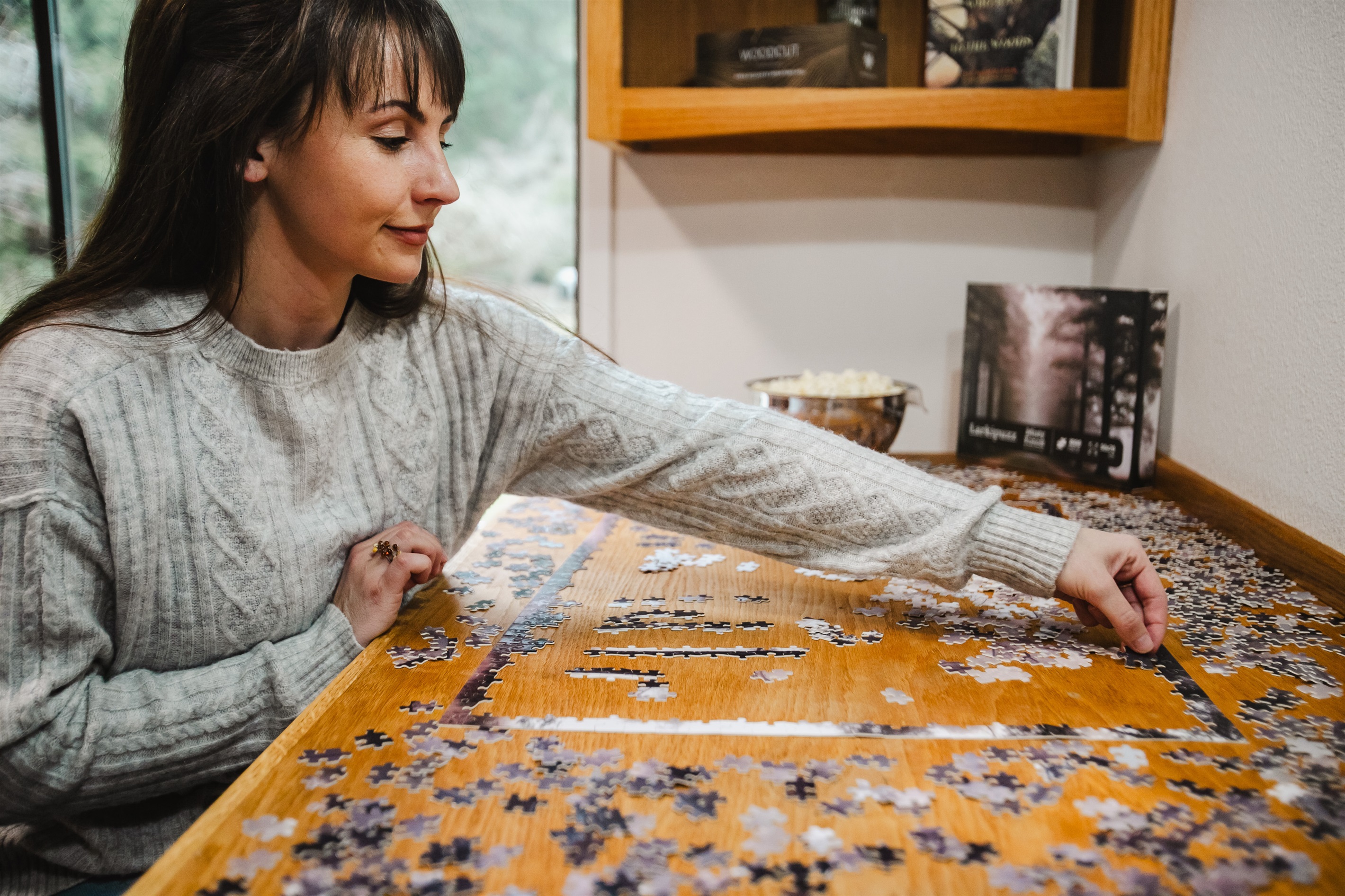 The dedicated and well-lit puzzle table in the library is a relaxing way to spend an afternoon.