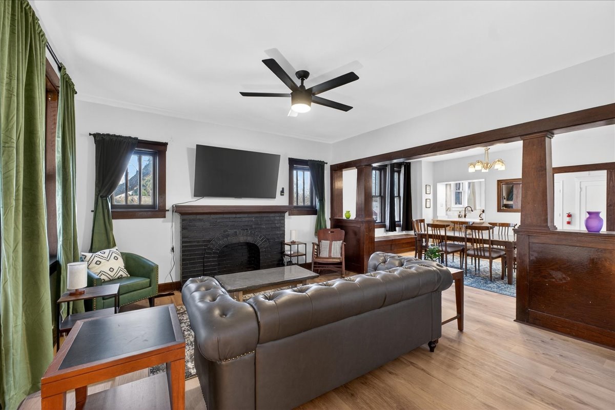 This open living room delivers a modern layout, creating a bold yet inviting setting for everyday living and dining.