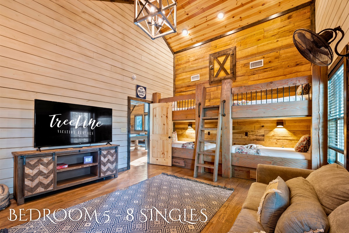 This room is equipped with 4 sets of twin bunk beds, ideal for group stays or families