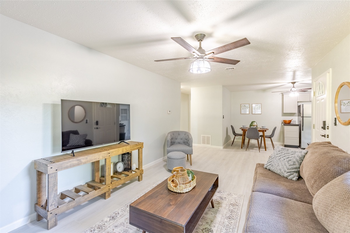 Inviting living room with smart TV and plenty of comfort.