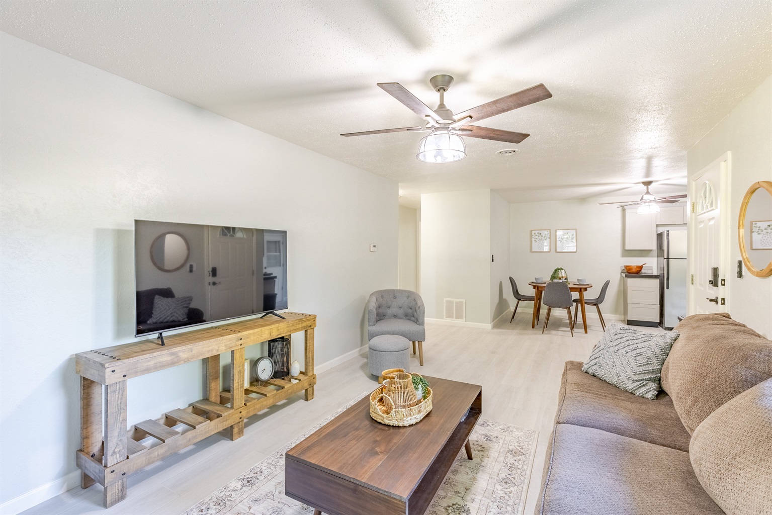 Inviting living room with smart TV and plenty of comfort.