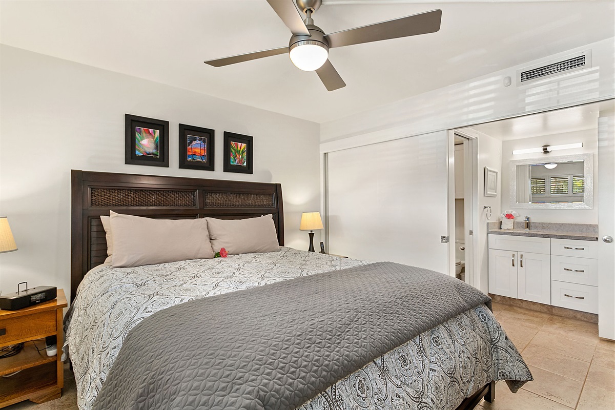 The bedroom is separated from the vanity area by a large sliding door