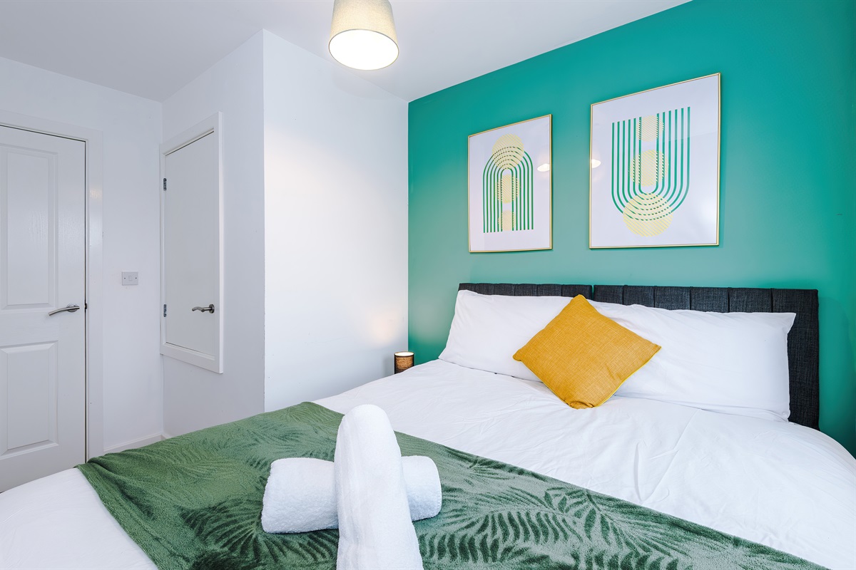 Bedroom 1 benefits from a hotel comfort king bed which can be arranged into 2 singles