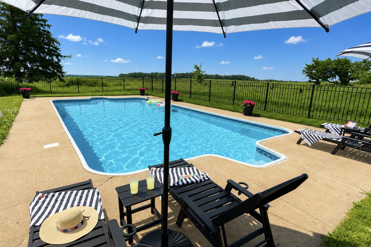 Your private pool oasis awaits! Lounge under striped umbrellas, cool off in the sparkling pool, gather around the fire pit, and soak in peaceful orchard views. The perfect backdrop for family vacations, friend getaways, and summer memories.