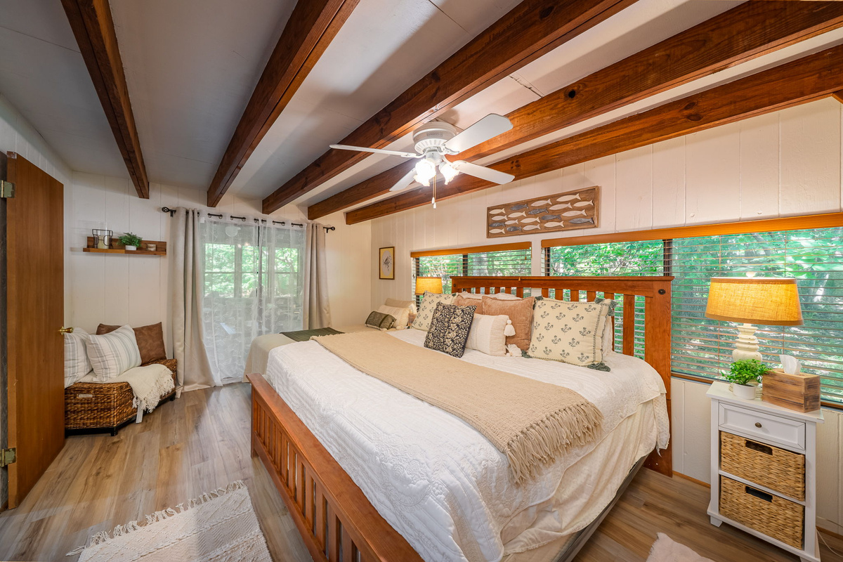 Slide the glass door open in the morning and step straight onto the deck — the Master bedroom has direct outdoor access.