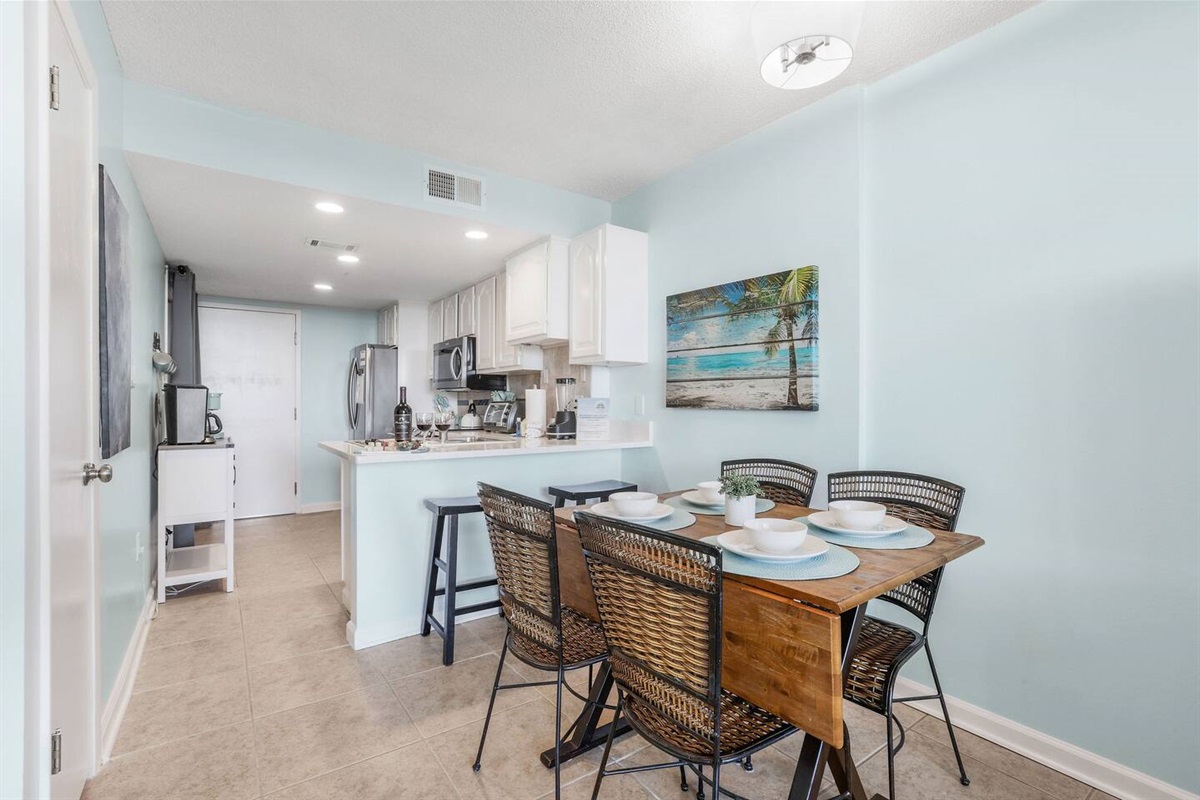 Enjoy a fully-stocked kitchen and a cozy 2-top bar and a space-saving dining table for 4, which folds out for more room and doubles as a gaming table for card and board game fun.