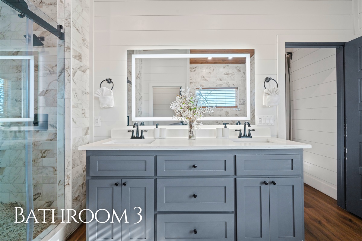 A bright vanity and sleek finishes make this bathroom feel modern, clean, and ready for easy mornings.