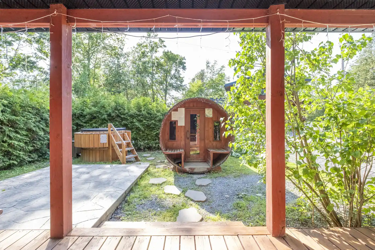 View from the covered porch toward the private barrel sauna