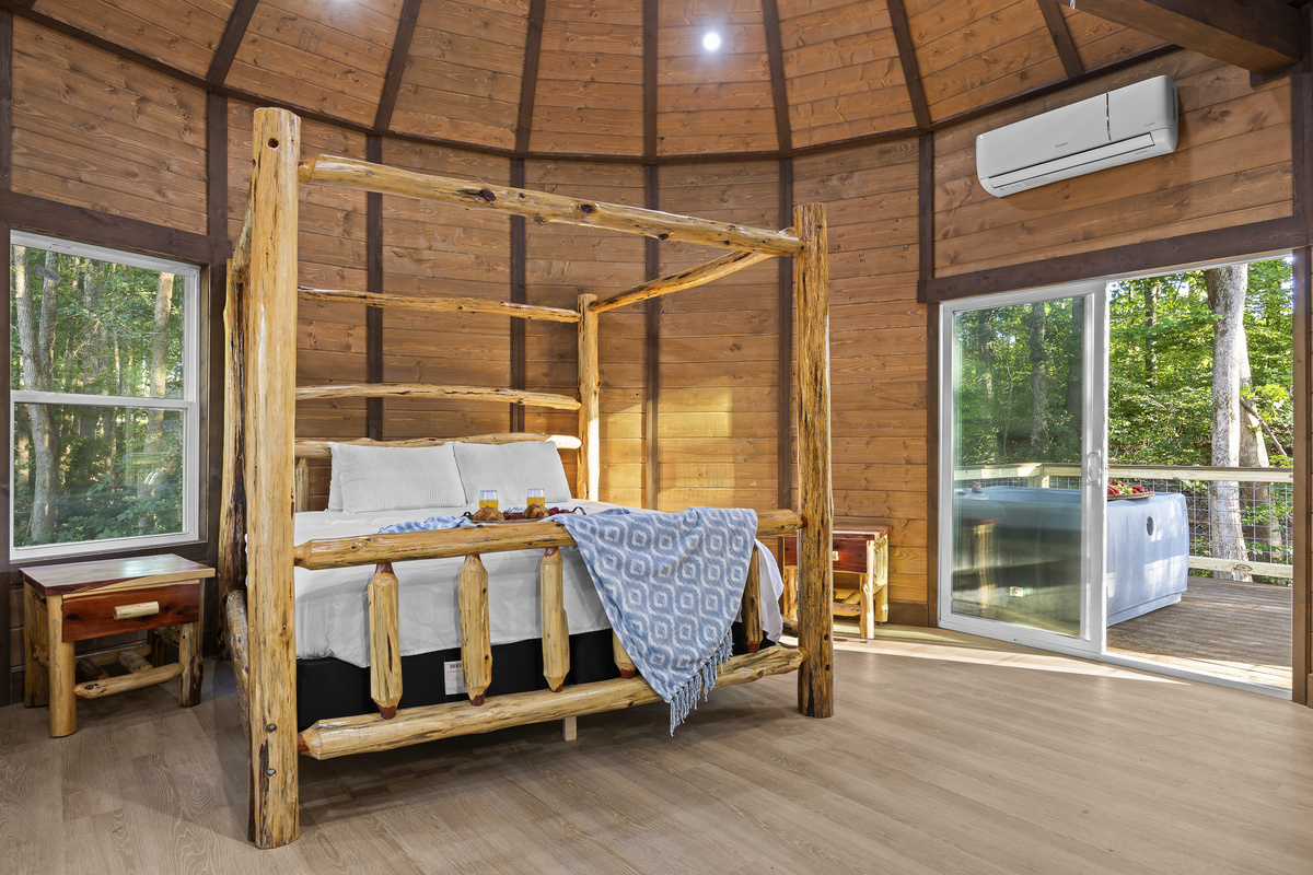 Rustic Retreat: Experience nature through panoramic windows from this stylish log bed haven!
