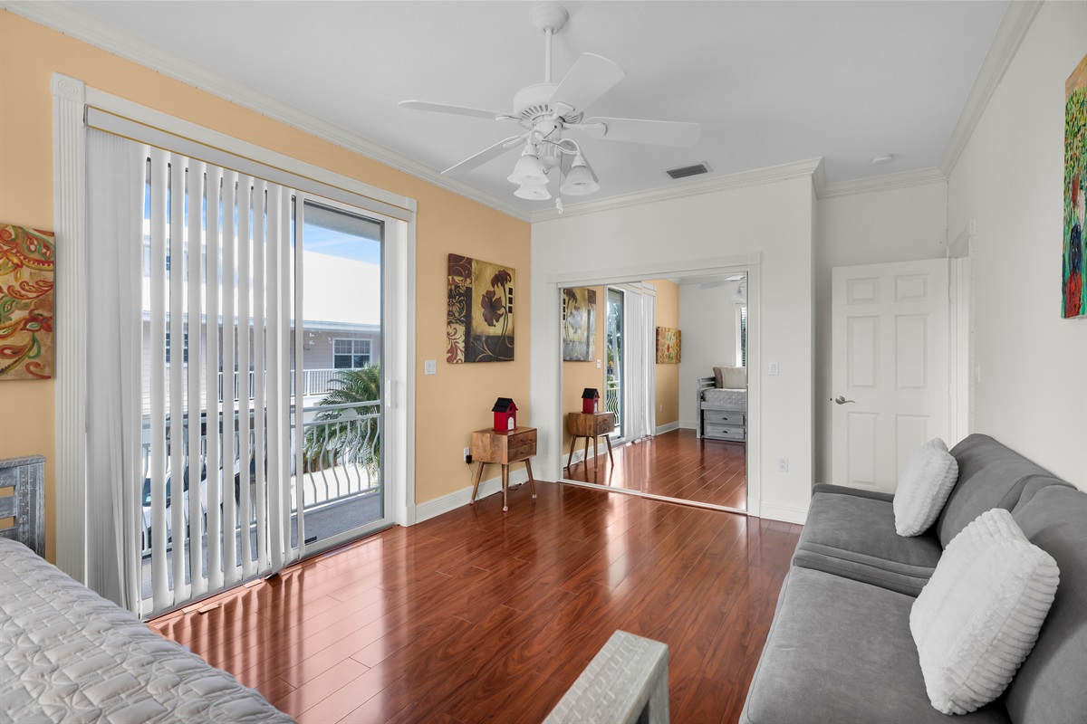 Guest bedroom featuring a twin with trundle and two oversized chair sleepers