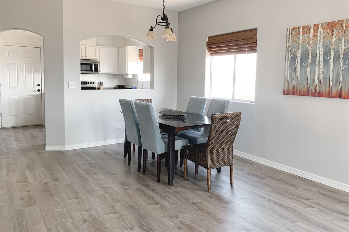 Bright dining area with seating for 6, conveniently located off the kitchen.