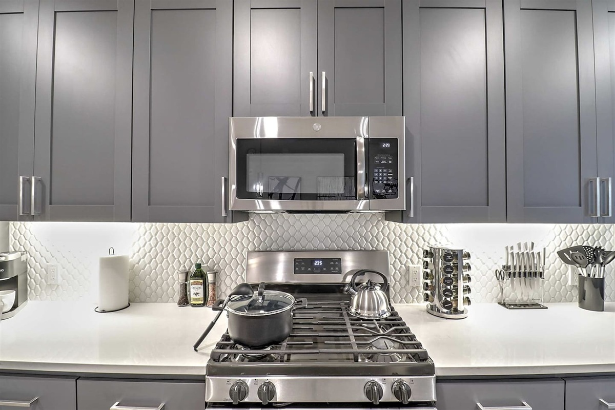 - Cook with ease using stainless steel appliances and a sleek modern backsplash   - Fully equipped kitchen with stove, microwave, and all essentials provided   - Designed for convenience, style, and effortless meal preparation anytime