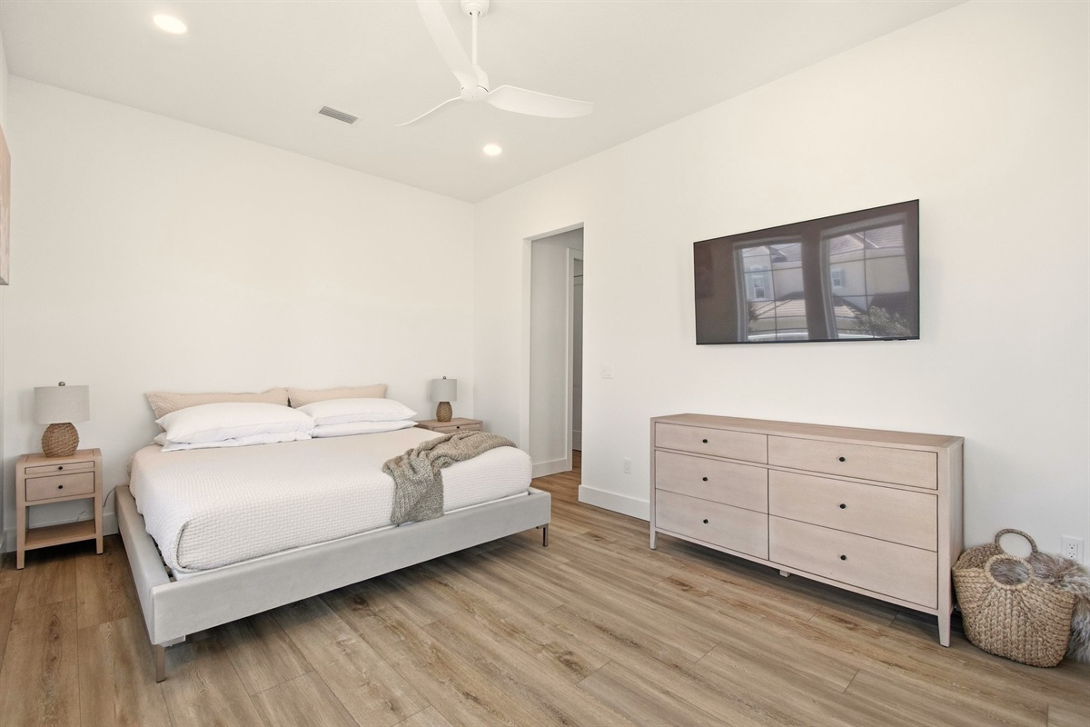 Slip into crisp linens after a sun-soaked day, let the ceiling fan whisper you to sleep, and wake up rested for another beach adventure. When you want a quiet night in, the big TV and calm palette make it effortless.
