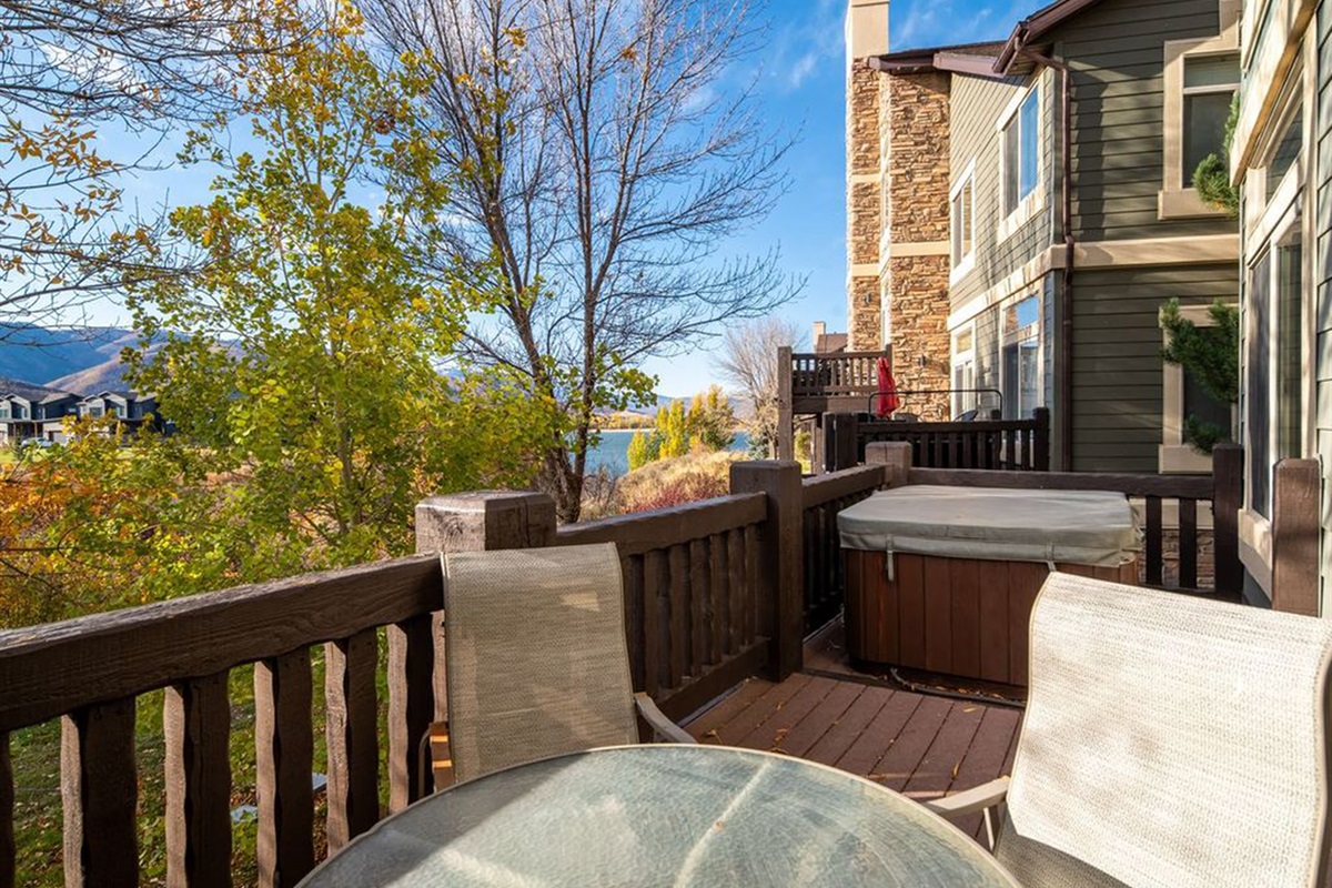 Private deck with seating and scenic views of the surrounding landscape.
