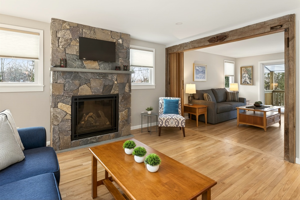 Living room to extends into a secondary seating area with queen fold out sofa