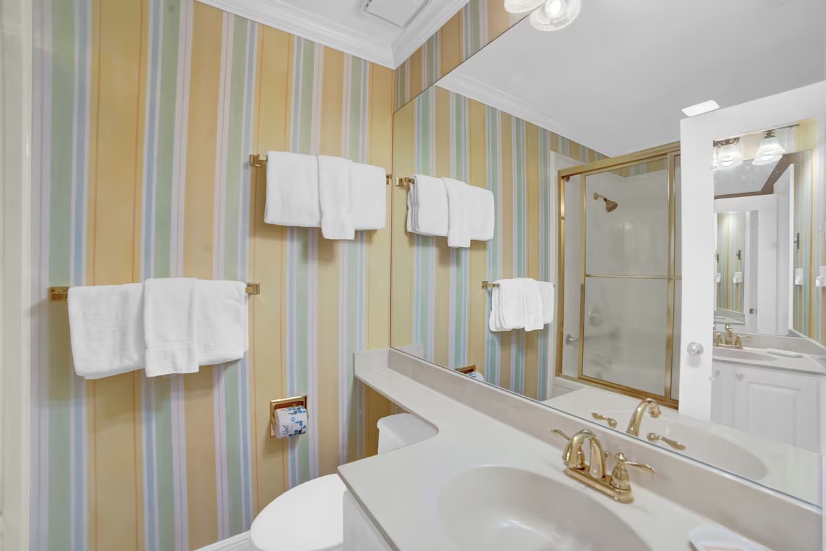 Primary en-suite bathroom will have double vanity, a separate water closet with a single vanity and a jetted tub with tiled shower walls so multiple guests can get ready at the same time. I will be removing the wallpaper and painting the walls as well. 