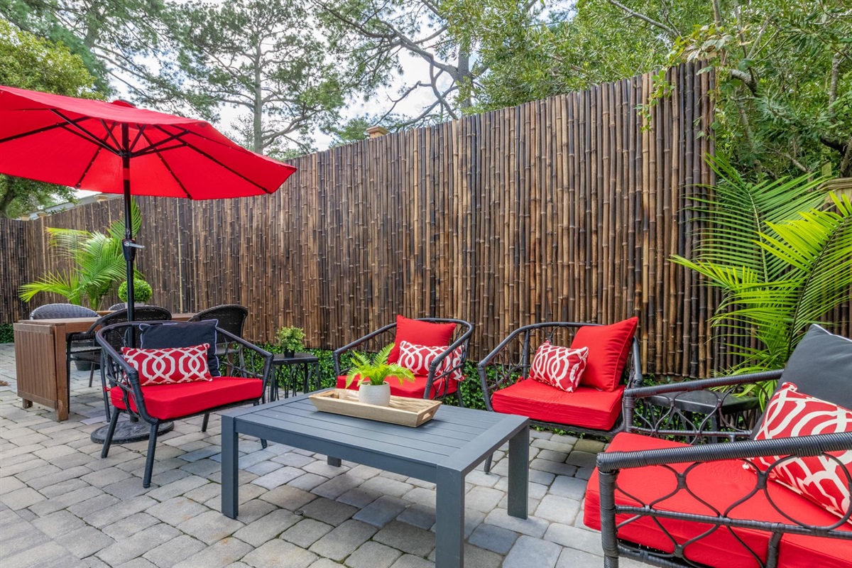 Enjoy the pool from this seating area