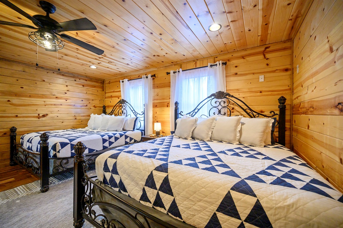 2 king beds in oversized room with smart tv
