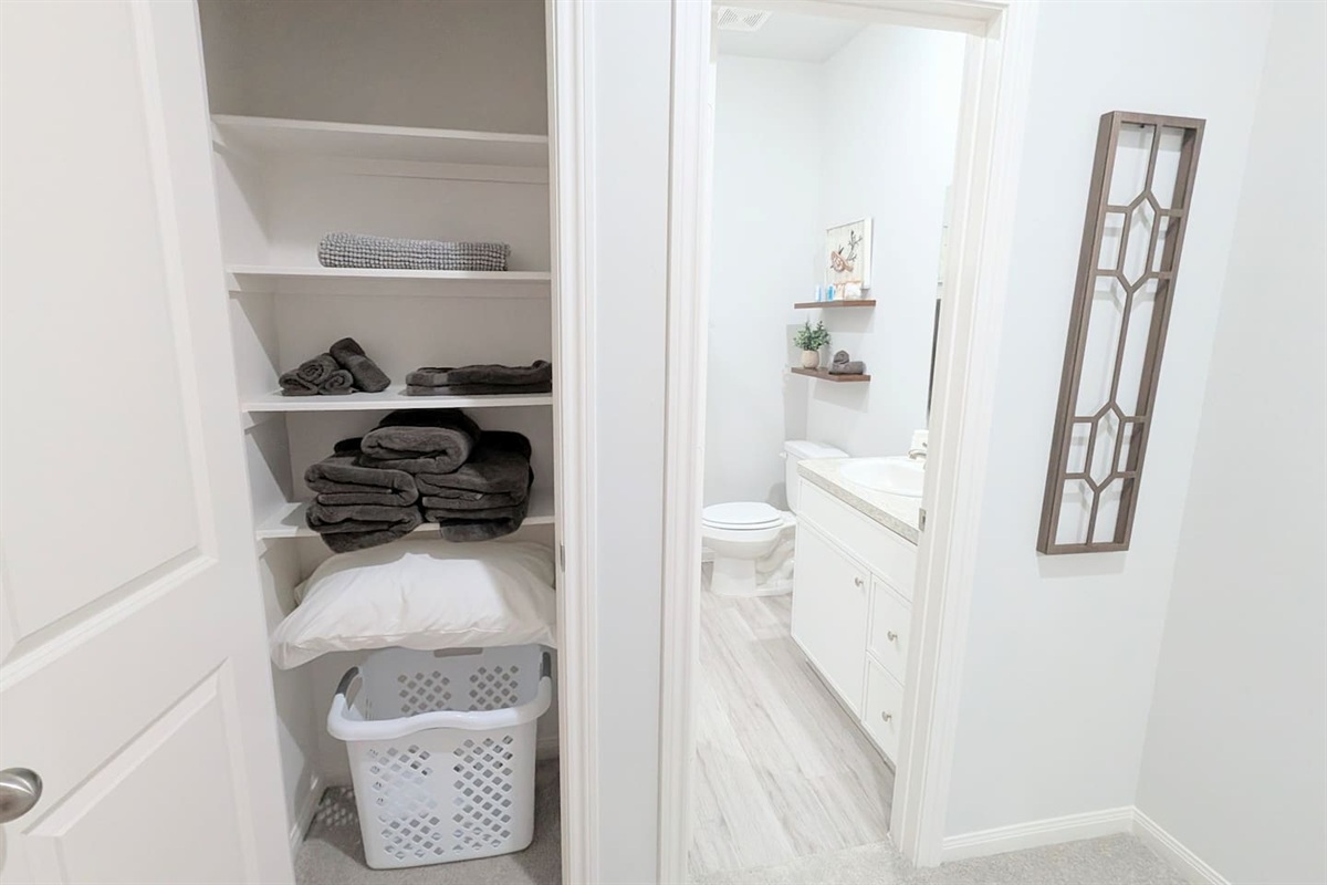 Linen closet is conveniently located outside the bathroom. 