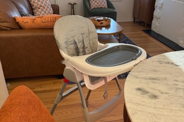 High chair stored in bedroom closet