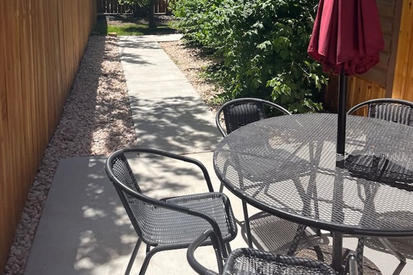 Outside backyard leading to hot tub.
