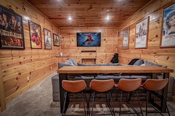 Grab a seat at the bar-height counter behind the sofa—ideal for snacks, drinks, or extra seating. Your private mountain movie night starts here!