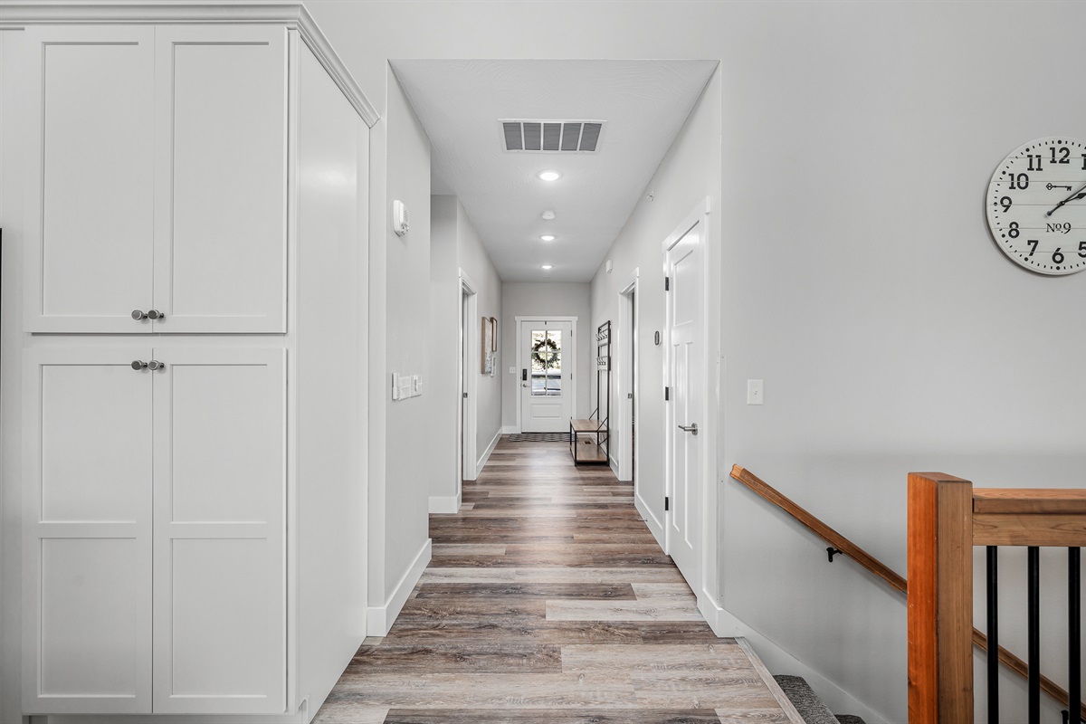Entry hall leads to two bedrooms and the laundry room.