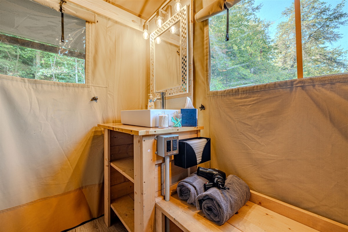 Dedicated space for your comfort. From the sink and vanity to the ample storage and included hairdryer, we've designed this area to make your stay as effortless and luxurious as possible.