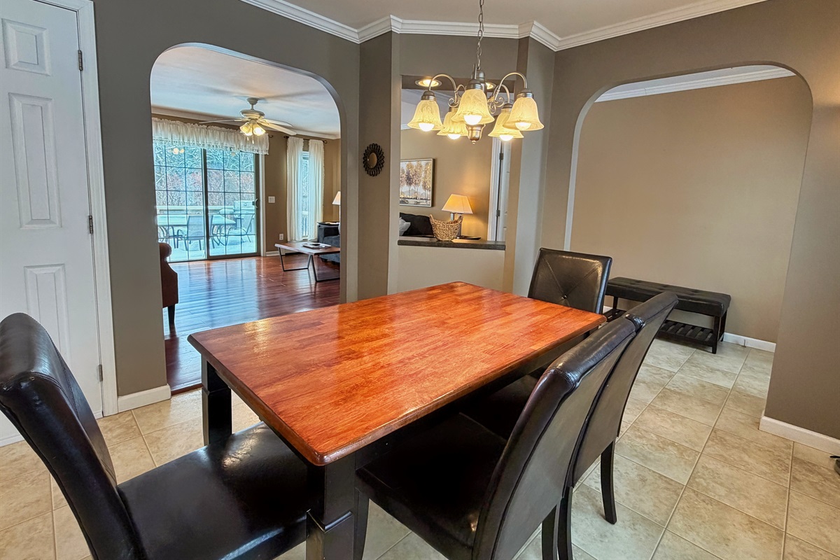 Dining room with living room and rear deck beyond