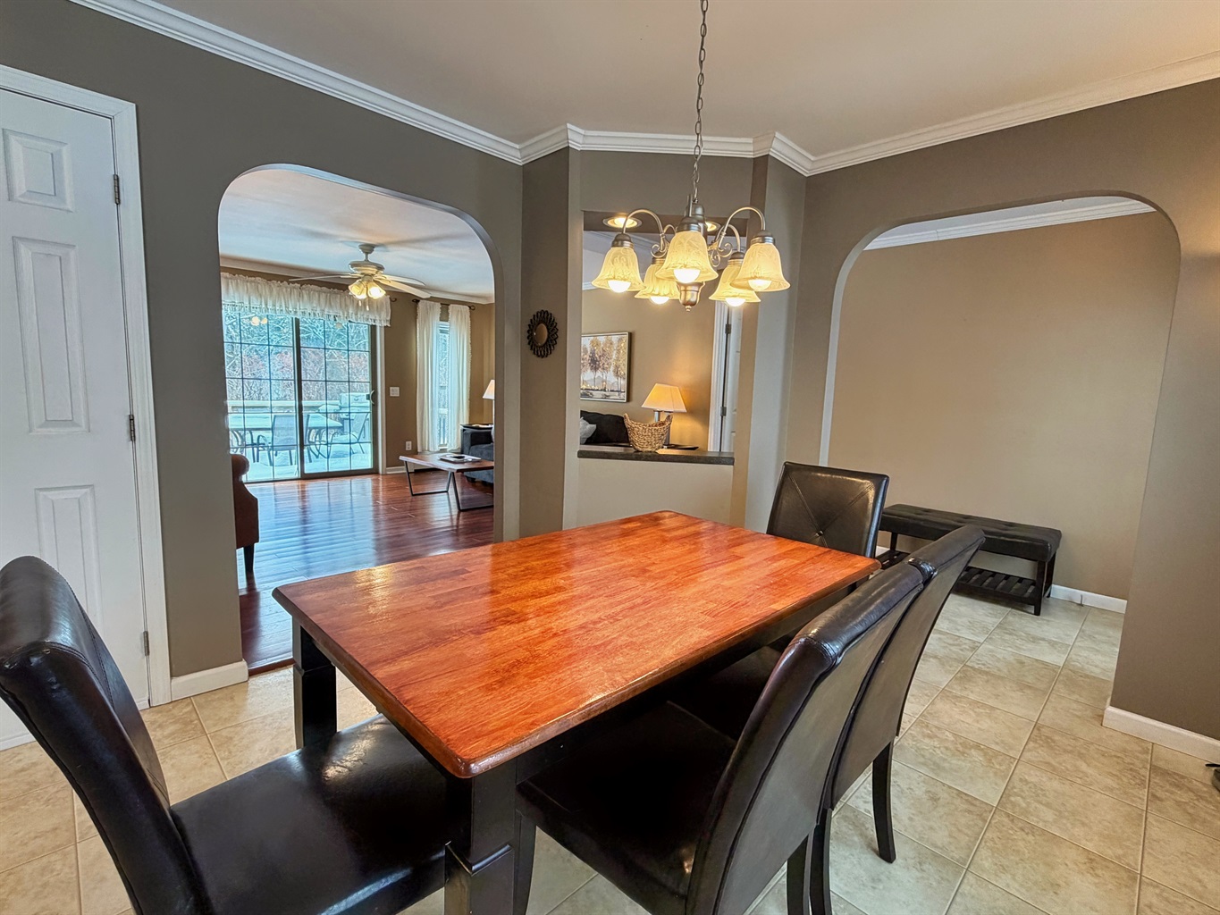 Dining room with living room and rear deck beyond