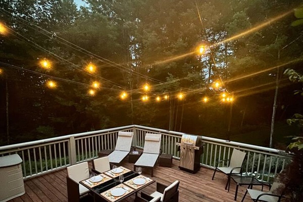 Cozy bistro lights brighten up the deck for evening activities