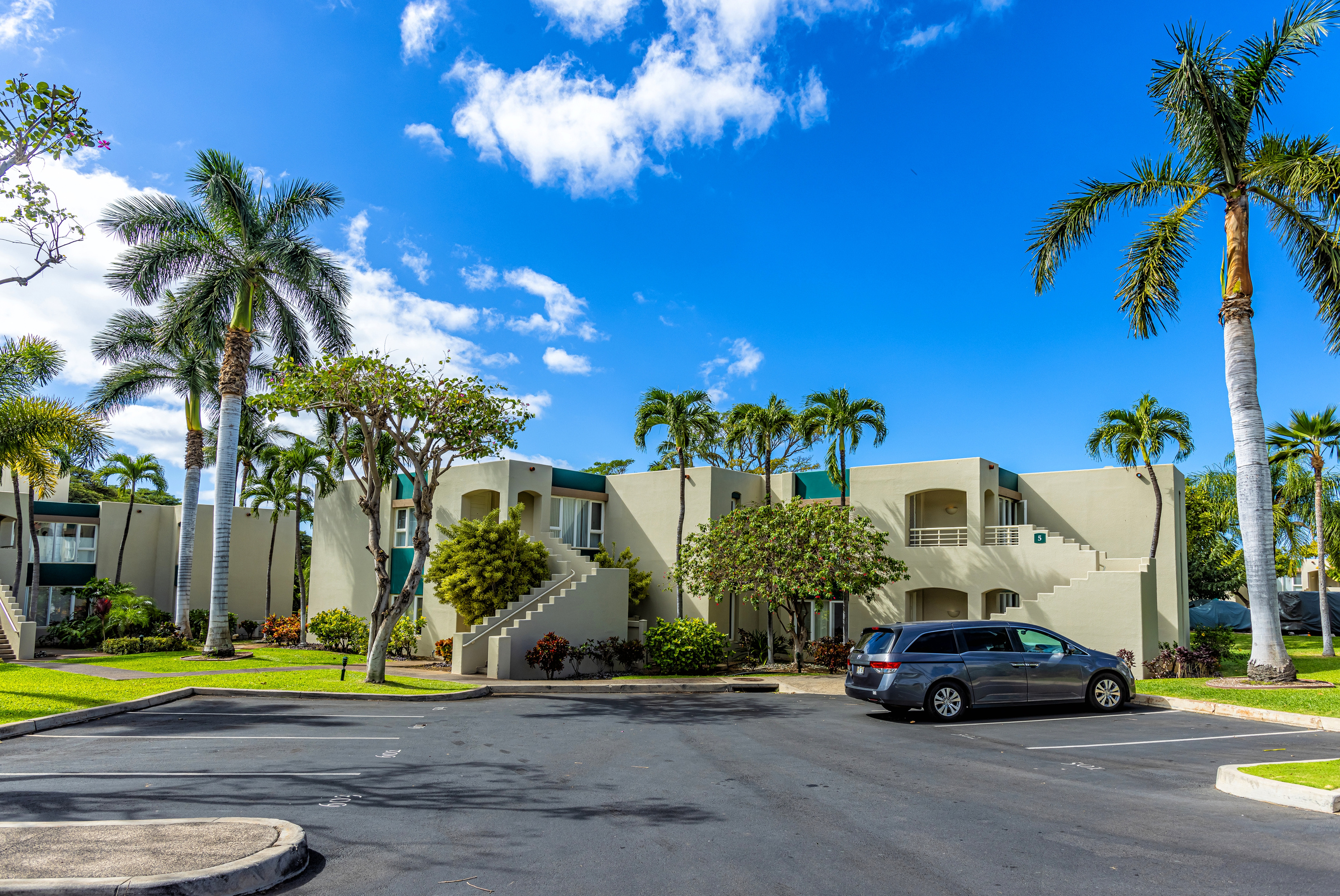 Coming down the driveway, the condo is straight ahead, behind the staircase (it is the ground floor unit). Your designated parking stall is where the van is parked.
