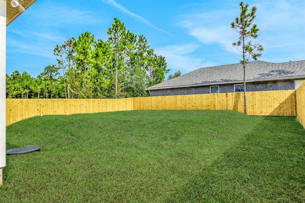 You (and your pets) will have full access to the fenced in back yard.  There is a septic mound in the back yard but as you can see the entire back yard has grass.