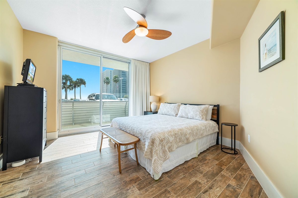 Enjoy the perfect blend of comfort and coastal beauty in this inviting guest room with king-size direct balcony access.