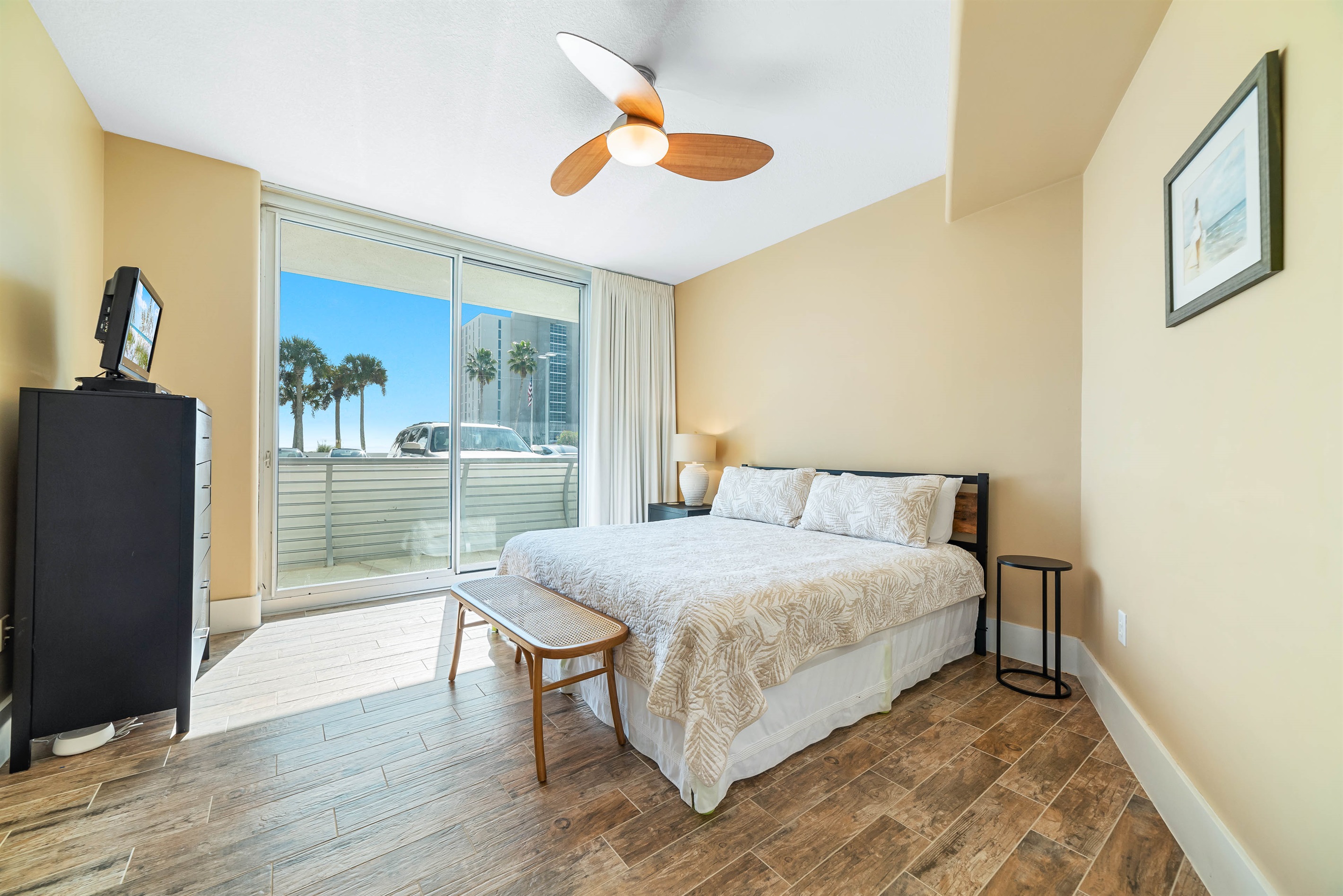 Enjoy the perfect blend of comfort and coastal beauty in this inviting guest room with king-size direct balcony access.